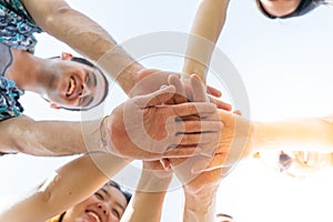 Teamwork, unity concept, group of friends put their hands together.