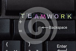 Teamwork word from blocks on keyboard close up