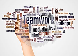 Teamwork word cloud and hand with marke concept photo