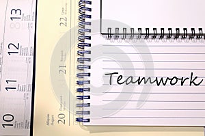 Teamwork write on notebook