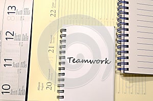 Teamwork write on notebook