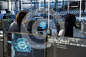 Teamworking data center colleagues managing AI training datasets using PC