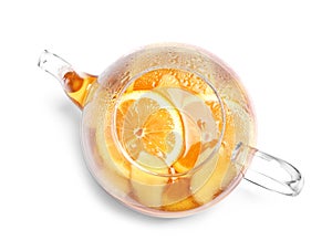 Teapot with lemon ginger tea on white background