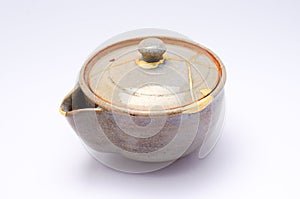 Teapot repaired with the antique kintsugi real gold technique