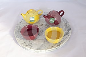 Teapot set with corresponding cups photo