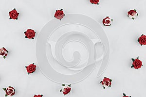 Teapot shape plate decorate with red rose
