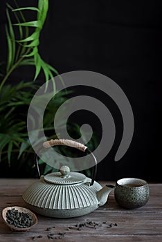 Teapot and Teacups on black background