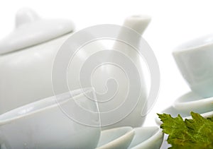 Teapot and white teacup