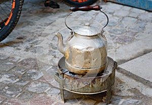 Teapot wtith burner for fire in medina of Essaouira