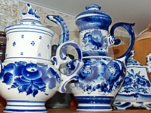 Teapots. Home tableware in Russian traditional Gzhel style. Closeup. Gzhel-Russian folk craft of ceramics and production porcelain