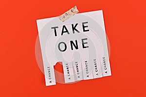 Tear-off stub note with text `Take a chance`