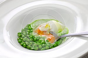 Tear peas with poached egg, spanish basque cuisine photo