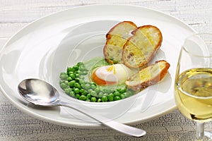 Tear peas with poached egg, spanish basque cuisine photo