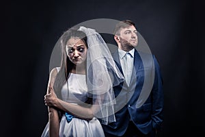 Tear-stained bride and brutal groom in suit