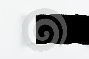 Tear white paper pieces of paper on black