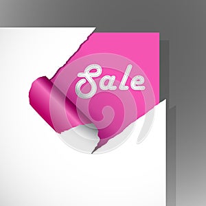 Teared pink paper with text.