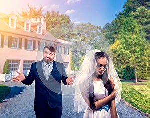 Tearful bride and puzzled groom, unhappy marriage