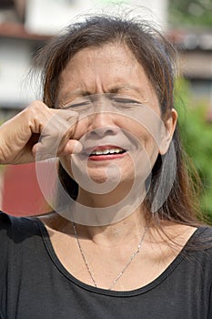 A Tearful Female Senior Grandma