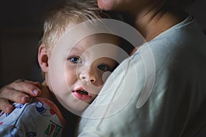 A tearful little boy clings to his mother to calm down. mother care and custody. relationship between parents and children