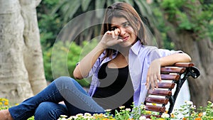 Tearful Youthful Female Sitting On Bench