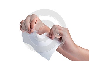 Tearing paper over white background