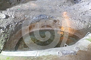 Tears of Queen Tamar, Holy Spring, Holy Water pond in carved cave in Vardzia Cave Monastery complex in Georgia