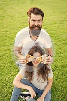 Teasing her with food. Fast food. Bearded man feeding woman cheesy pizza. Couple in love dating outdoors eat pizza