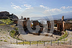 Teatro Antico di Taormina Ancient Amphitheatre in Sicily, Italy during sunny day with sea in the background