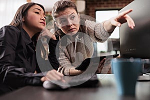 Tech enginners collaborating on coding project