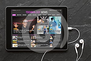 Tech news website on tablet.