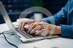 Tech savvy typing mans hands proficiently operate PC keyboard