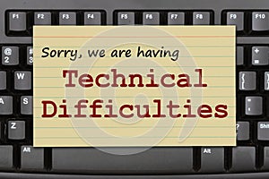 Technical Difficulties message on a black keyboard photo