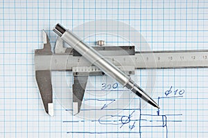 Technical drawing and callipers with pen photo