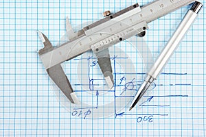 Technical drawing and callipers with pen