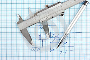 Technical drawing and callipers with pen photo