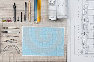 Technical drawing with millimeter paper and drawing tools. Mathematics and engineering