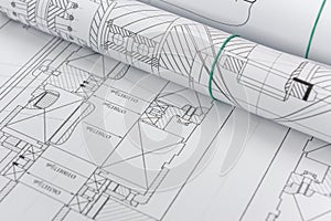 Technical drawings with blueprints in rolls close up. Engineering concept