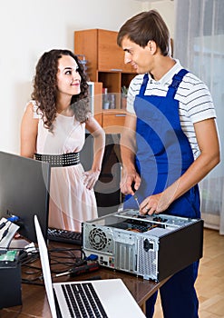 Technical engineer upgrading hardware of client computer