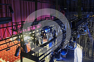 Technical equipment at the backstage of theater. Stage spot lighting rigging structure for a musical theater events