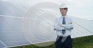 Technical expert in solar energy photovoltaic panels, remote control performs routine actions for system monitoring using clean, r