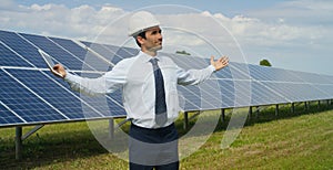 Technical expert in solar energy photovoltaic panels, remote control performs routine actions for system monitoring using clean, r