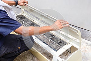 Technical man team clean air conditioning system, Repairman washing dirty cover air conditioners on the floor, Maintenance and