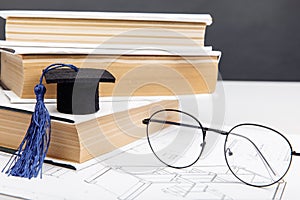 Technical project, glasses and graduation cap with books. Engineering education concept