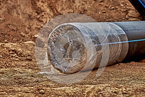 Technical sealing of the end of the water pipe with a stretch film to prevent the ingress of soil and moisture