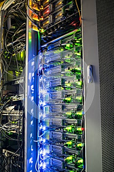 Technical site of the telecommunication Internet provider. Vertical racks with modern computer equipment are in the server room