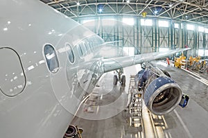 Technical specialists and aircraft technicians install the reverse engine after scheduled service.