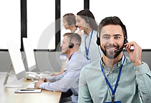 Technical support operator with colleagues