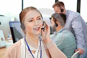 Technical support operator with colleagues in