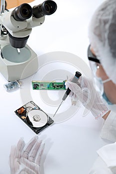 Technical surgeon working on hard drive - data recovery