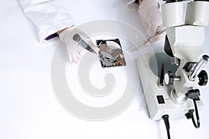 Technical surgeon working on hard drive - data recovery